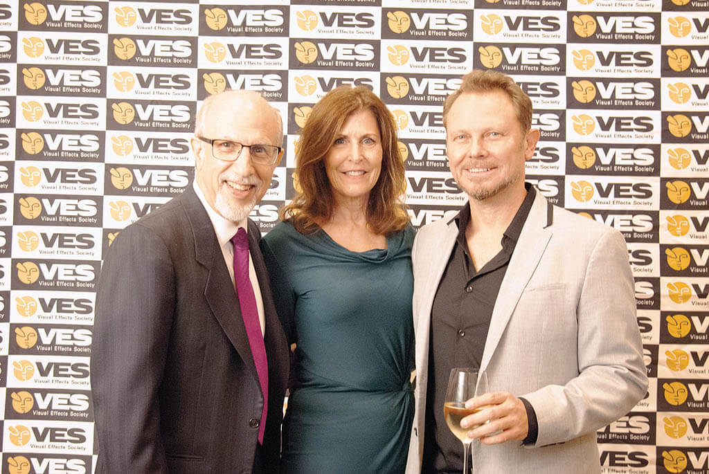 VES Chair Lisa Cooke (center), Executive Director Eric Roth and VFX Supervisor Richie Baneham accepting VES Honors for director James Cameron.