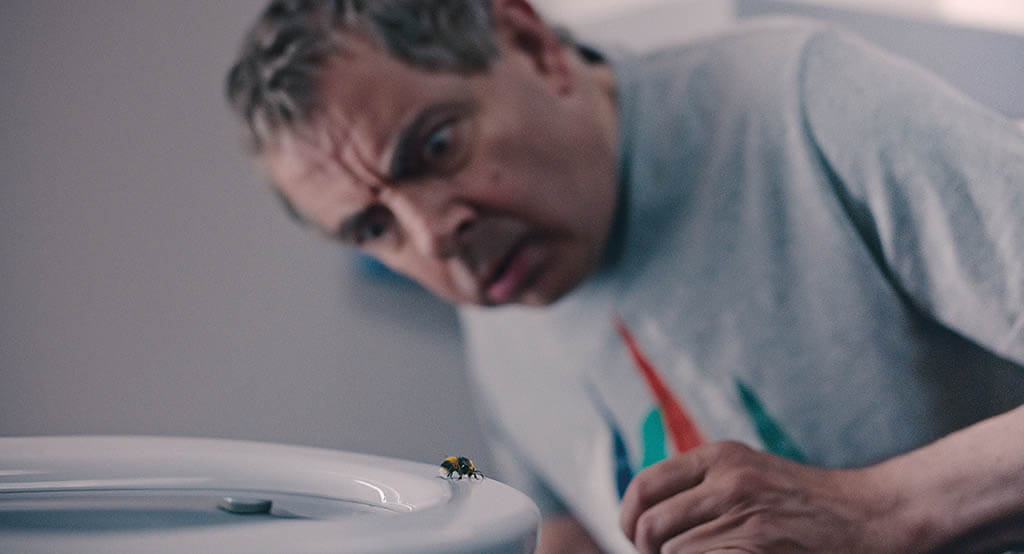 The physical actions of Rowan Atkinson dictated the placement of the insect adversary in the Netflix series Man vs. Bee. (Image courtesy of Netflix)