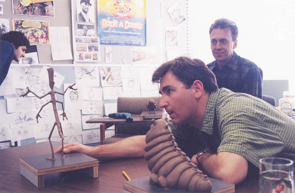 A Bug’s Life Art Director Bob Pauley and sculptor Norm DeCarlo examine maquettes for Slim and Heimlich. (Image courtesy of Pixar)