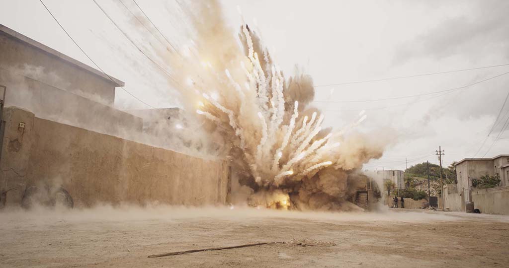 The IED device explosion consisted of compressed air, pyrotechnics, cork, dust and debris, which was then heightened digitally to make it feel more lethal. 