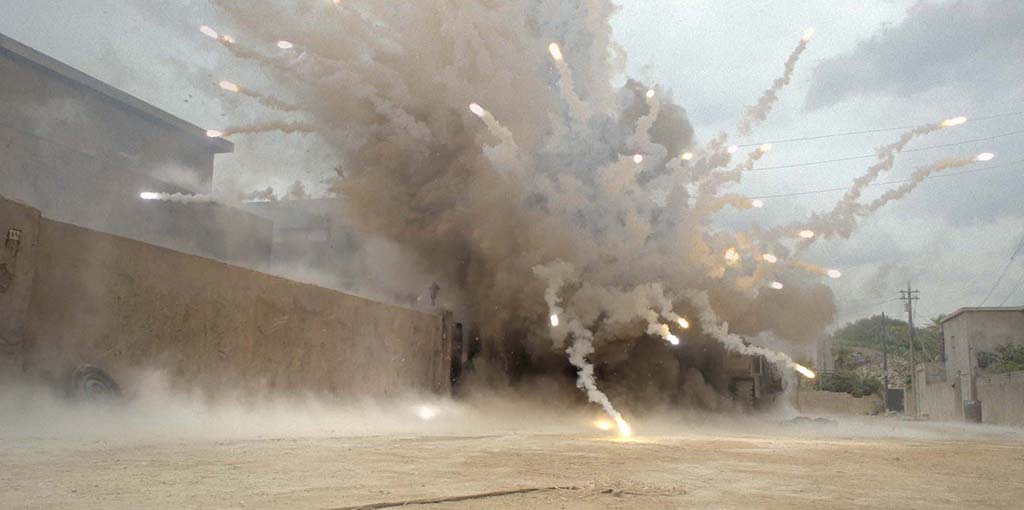 The IED device explosion consisted of compressed air, pyrotechnics, cork, dust and debris, which was then heightened digitally to make it feel more lethal. 