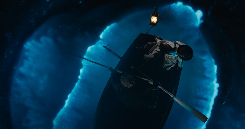 Practical lights assisted in enabling the bioluminescence situated beneath the water to interact with the boat.