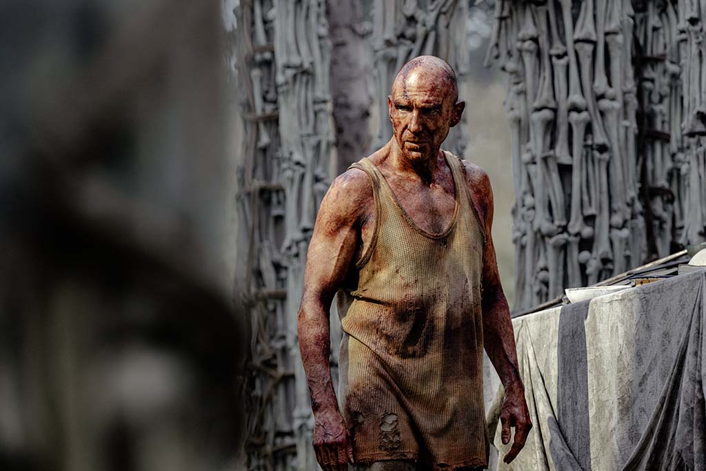 Dr. Kelson, portrayed by Ralph Fiennes, is attempting to survive a world that has become more primitive. (Photo: Miya Mizuno) 