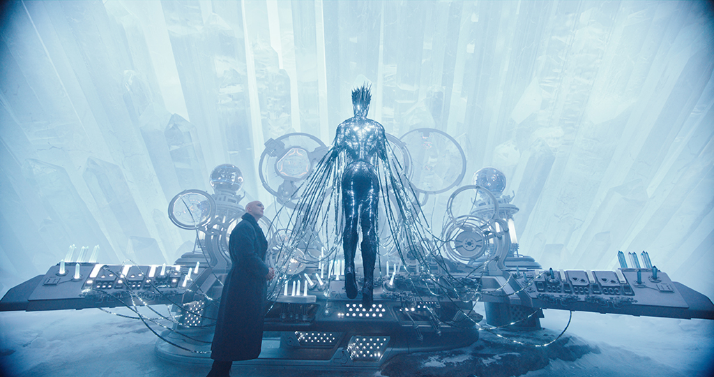 The Engineer plugs herself into the computer system of the Fortress of Solitude, causing spikes to form on her head. 