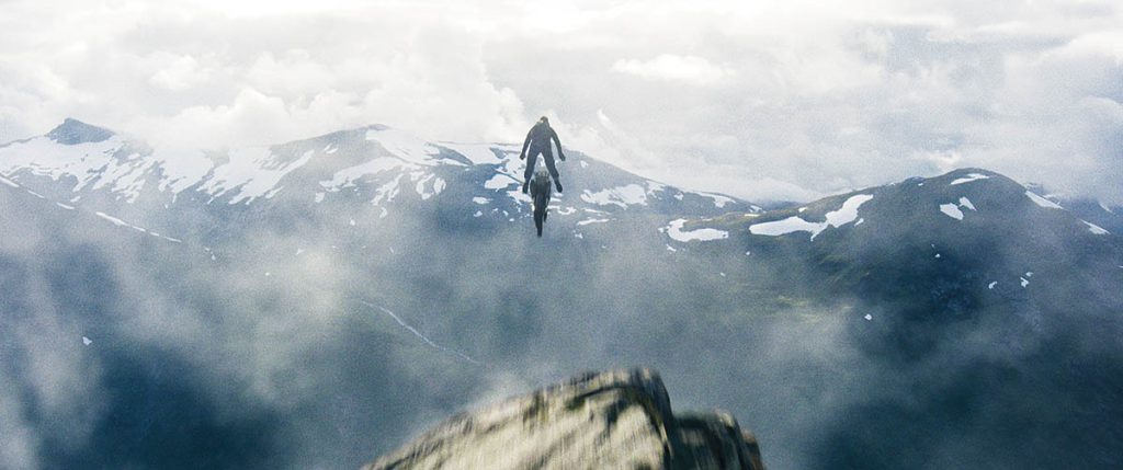 Visual effects painted out the ramp that enabled Tom Cruise to drive off a cliff on a motorbike in Mission: Impossible – Fallout.(Image courtesy of Paramount Pictures) 