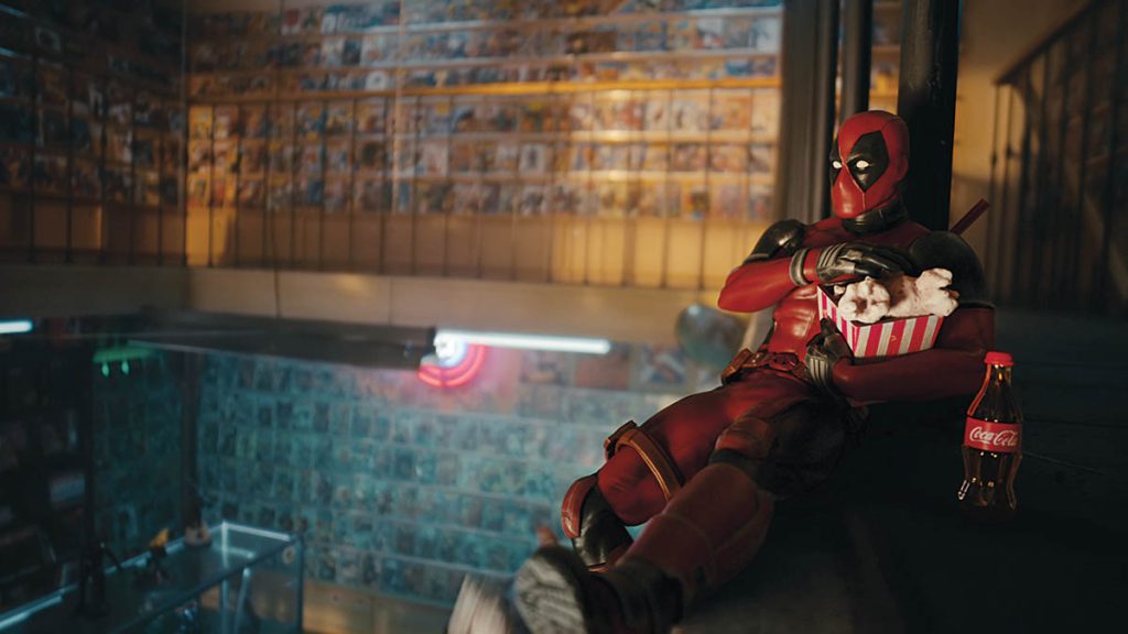 Deadpool enjoys popcorn and a Coke in the comic-book shop created by Electric Theatre. (Image courtesy of Coca-Cola and Marvel)