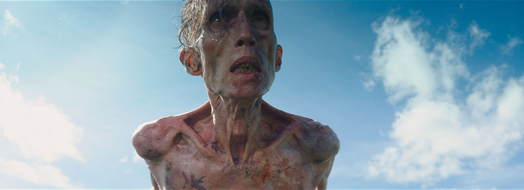 Visual effects worked closely with prosthetics to build a multi-stage progression system, from early Infection to full degeneration.
