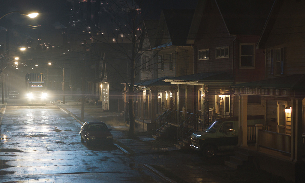 Set dressing, like wet asphalt and lights in the distance, provided the desired scope and mood for the nighttime shots. 