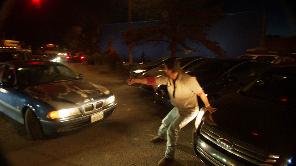 Matthew McConaughey attempts to direct traffic so the school bus can escape.