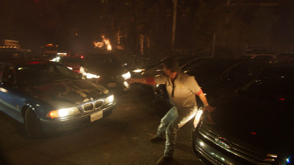 Matthew McConaughey attempts to direct traffic so the school bus can escape.