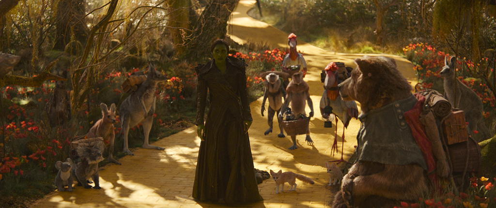 While listening to Elphaba, Dulcibear carries the weight of being exiled in her demeanor.