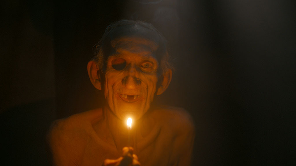 The face of Peter Schoelier was resculpted to remove the teeth, tongue and create the skull eye.