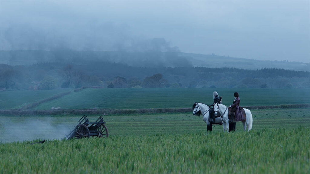 A village is digitally integrated into the mist-covered landscape.