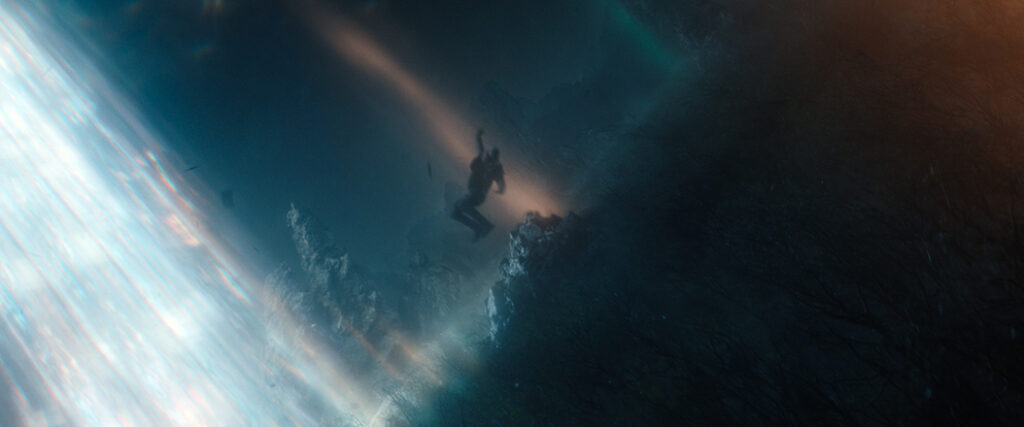 Lee Shaw attempts to escape from Axis Mundi in a transport pod, which unleashes Titan X.