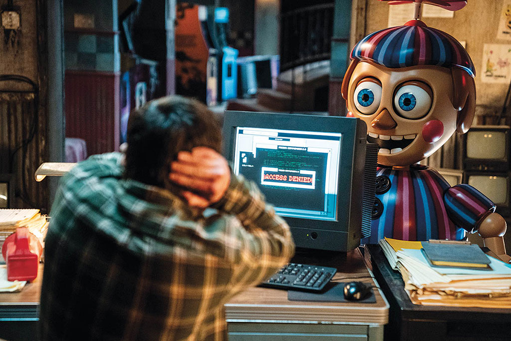 Mike (Josh Hutcherson) and Balloon Boy in Universal’s Five Nights at Freddy’s 2, based on the Scott Cawthon 2014 horror video game. (Photo: Ryan Green. Images courtesy of Universal Pictures)