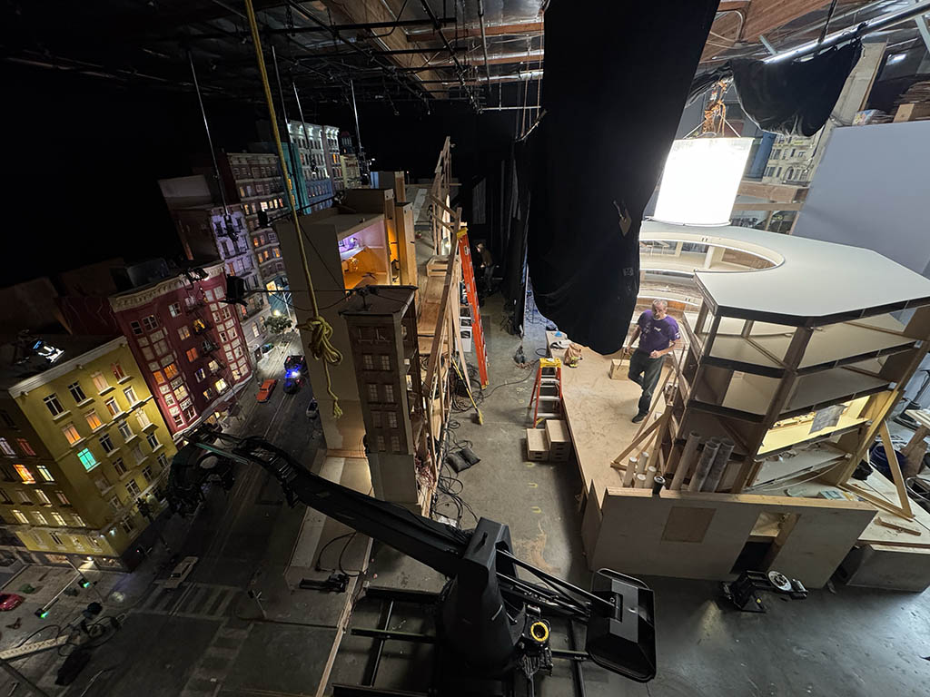 For the chase set inside of a shopping mall, Warren, pictured above with his brother, combined location photography, miniature construction and traditional effects techniques.