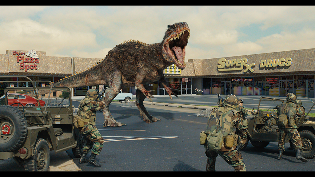 A strip-mall parking lot becomes a battleground between the military and an Allosaurus.
