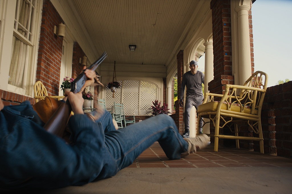 The enormous Allosaurus makes the front porch feel claustrophobic and dangerous.