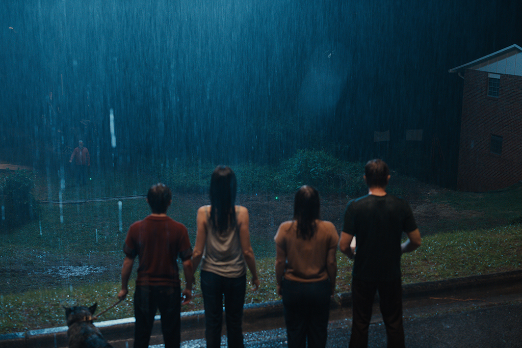 Practical rain and digital mist heighten the eeriness of the nighttime shots.